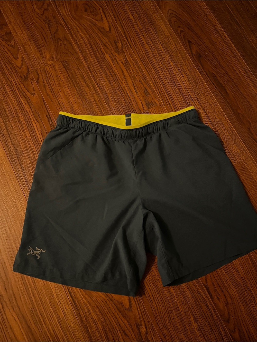 Arc'teryx Men’s Dark Gray Athletic Shorts with Yellow Waistband
